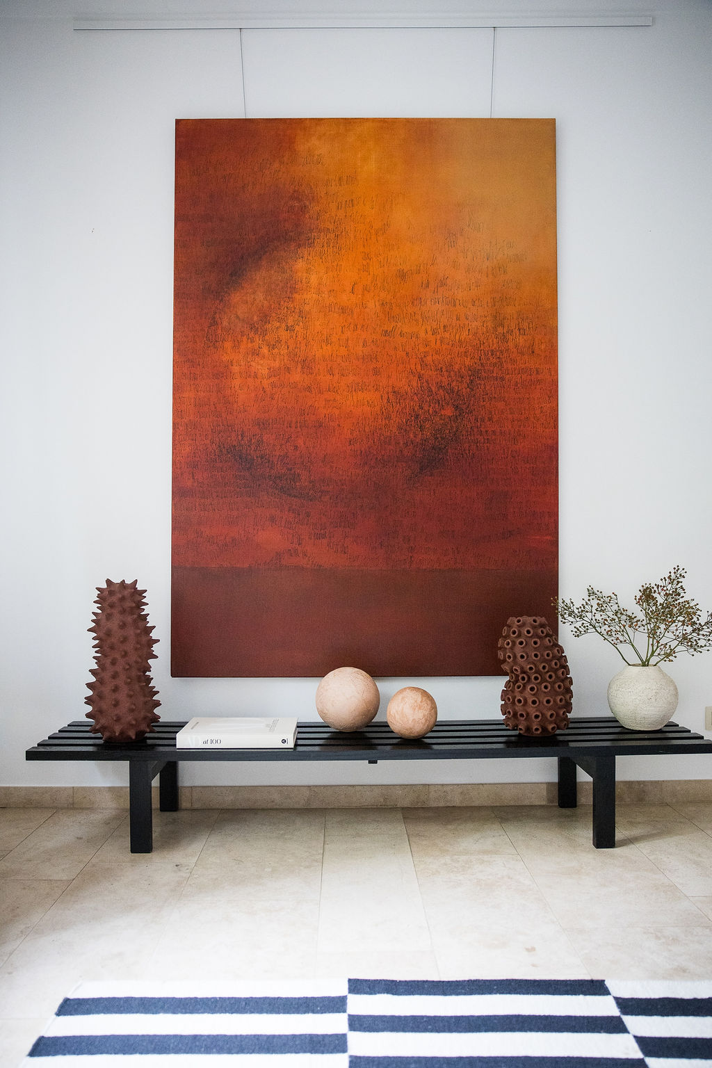 Large abstract painting by Belgian artist Charlotte Vindevoghel. Charlotte Vindevoghel explores in her new serie the thematic of Cosmos. Deep red and brown tones painting with black writings. 