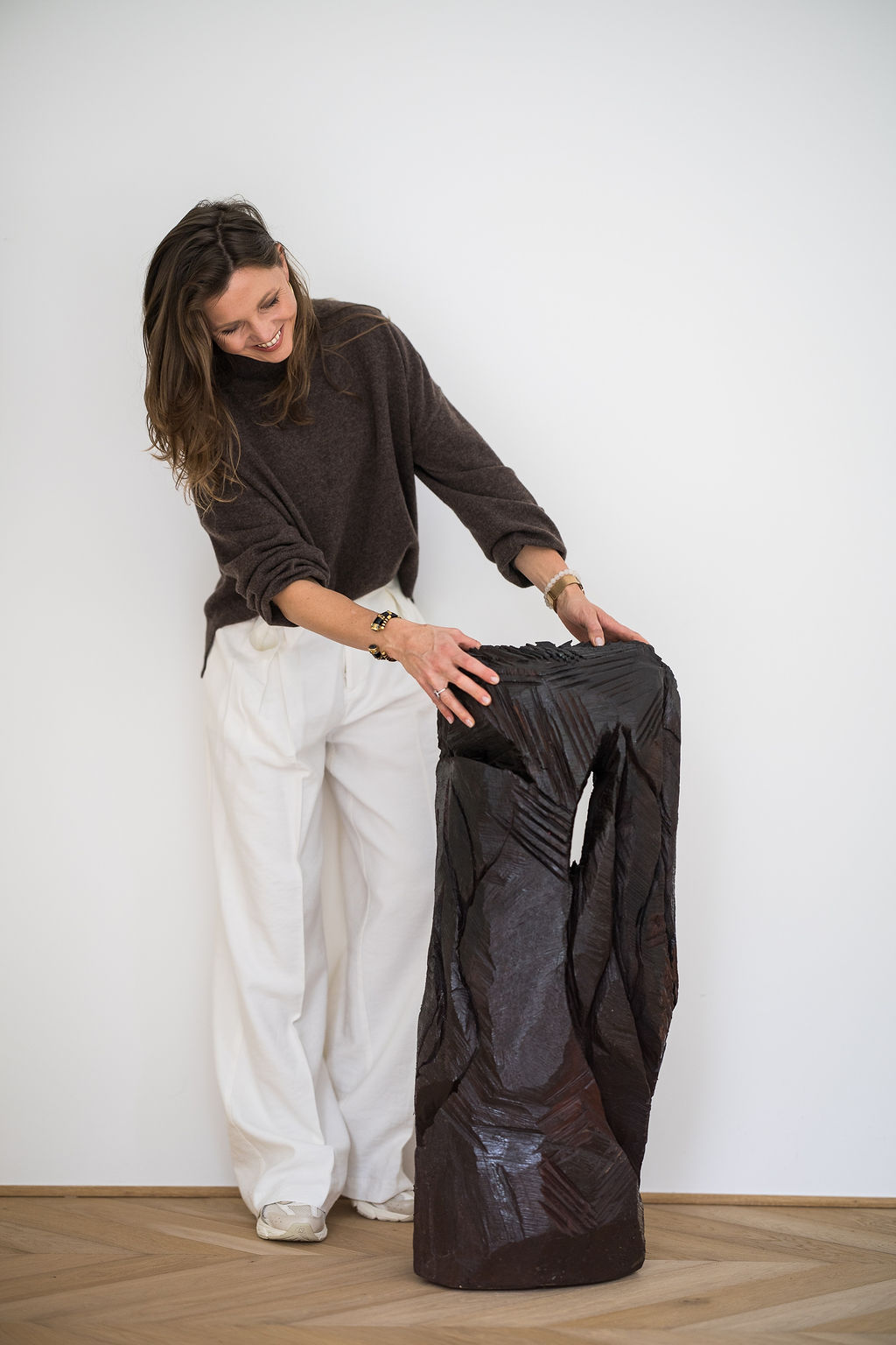 Burnt Wooden Sculpture by Jean Boghossian. This striking burnt-wood sculpture by Jean Boghossian embodies the artist’s fascination with the transformative power of fire. Rising vertically with bold presence, the piece reveals a sequence of carved, spiraling segments that create a dynamic sense of movement—almost as if the wood is twisting itself upward in response to the heat that shaped it. Boghossian’s signature technique of working with flame is evident in the deep, textured char that envelops the surface. Each burn mark and fissure becomes part of a visual language that speaks to destruction and renewal, fragility and resilience. The dark, richly carbonized wood contrasts beautifully with the sculpture’s elegant form, inviting viewers to reflect on how raw materials can be altered, scarred, and yet transformed into something profoundly expressive. Minimalist yet powerful, this work captures Boghossian’s ongoing exploration of combustion as both a tool and a metaphor—revealing beauty in the unpredictable dialogue between artist, material, and fire.