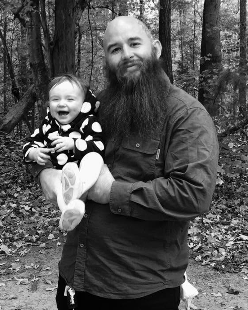 Andrew Lewis in 2017 at 260 pounds, holding his daughter as a baby