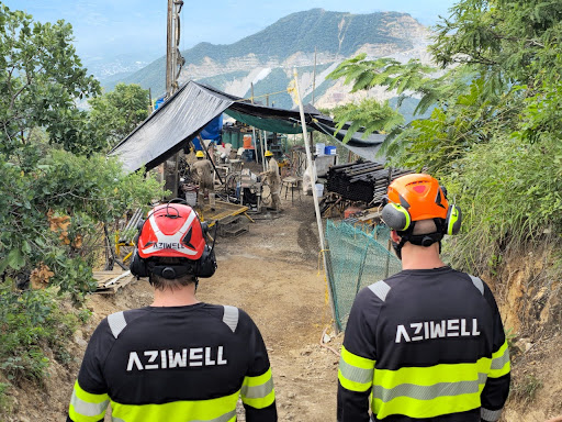 Two Aziwell operators observing the exploratory project site