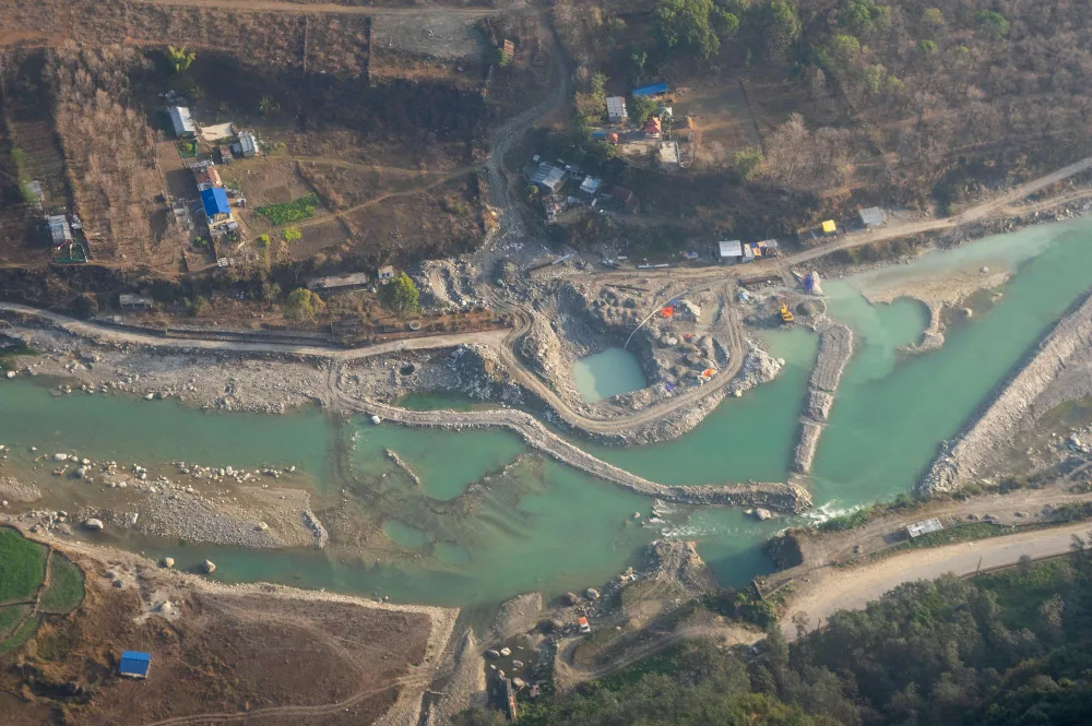 Bird's eye view of a mining operation near a riverbed