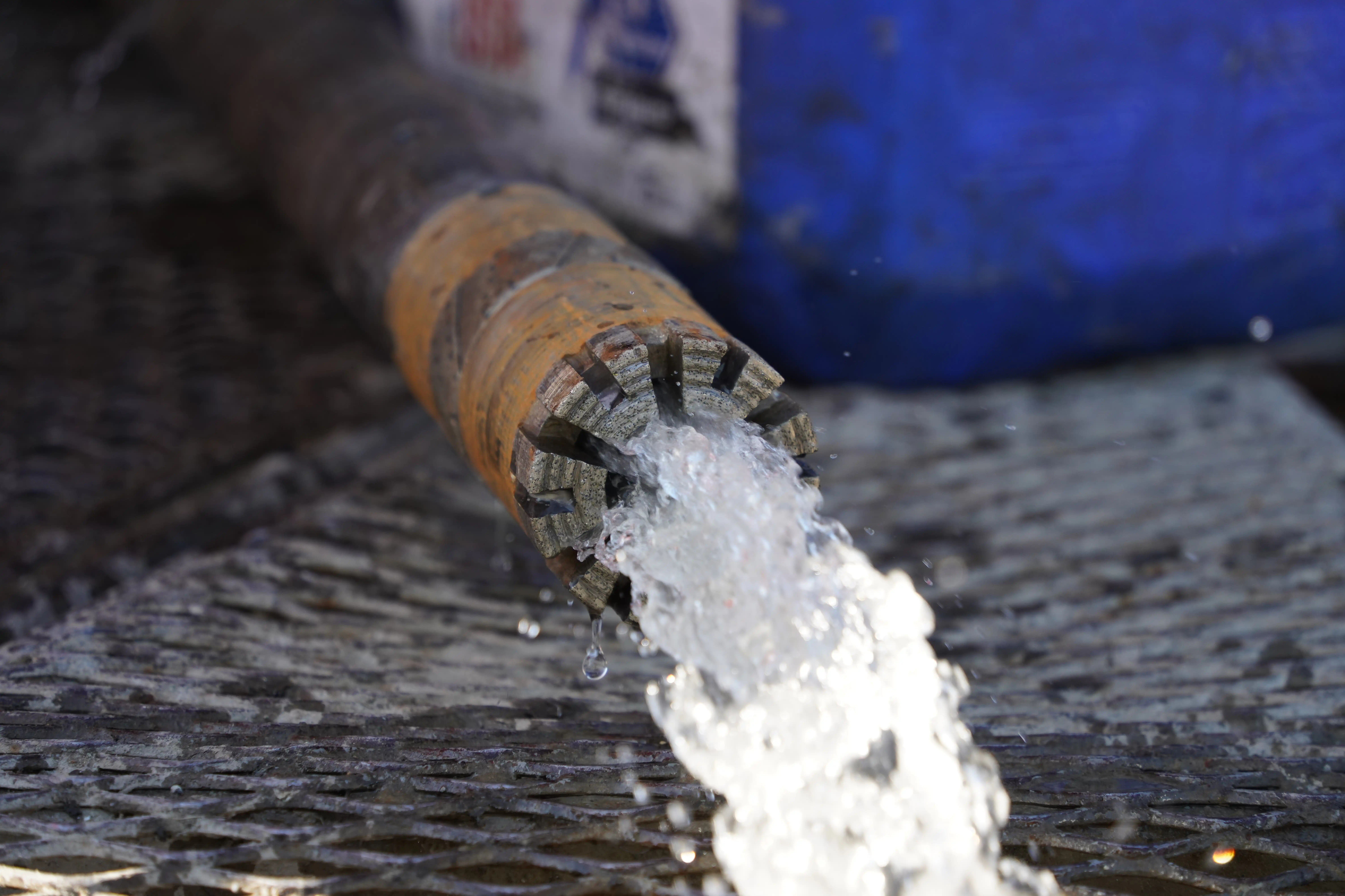 Groundwater running out of pipes from a drilled borehole.