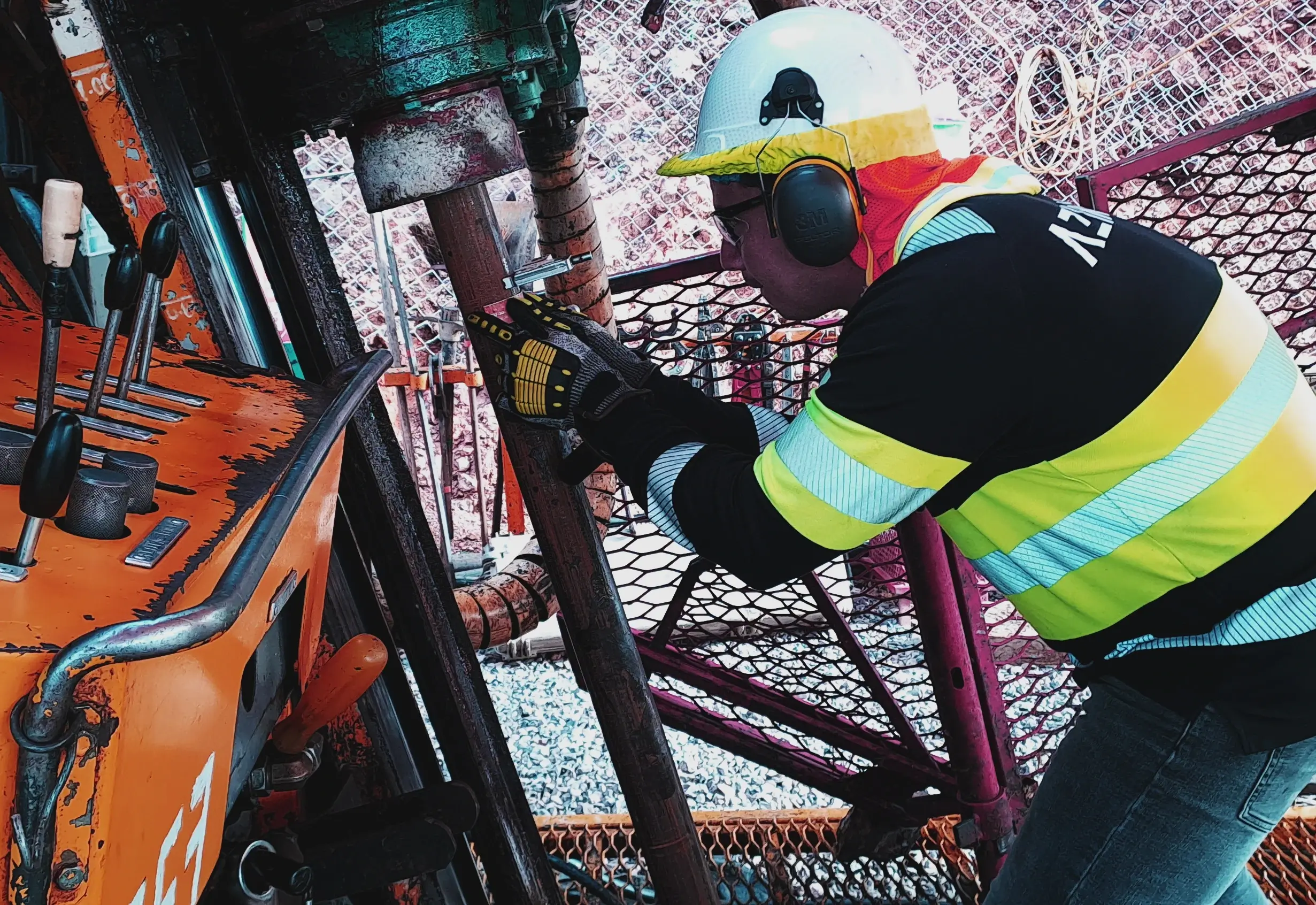 Operator dressed in protective gear handling the Azidrill on site