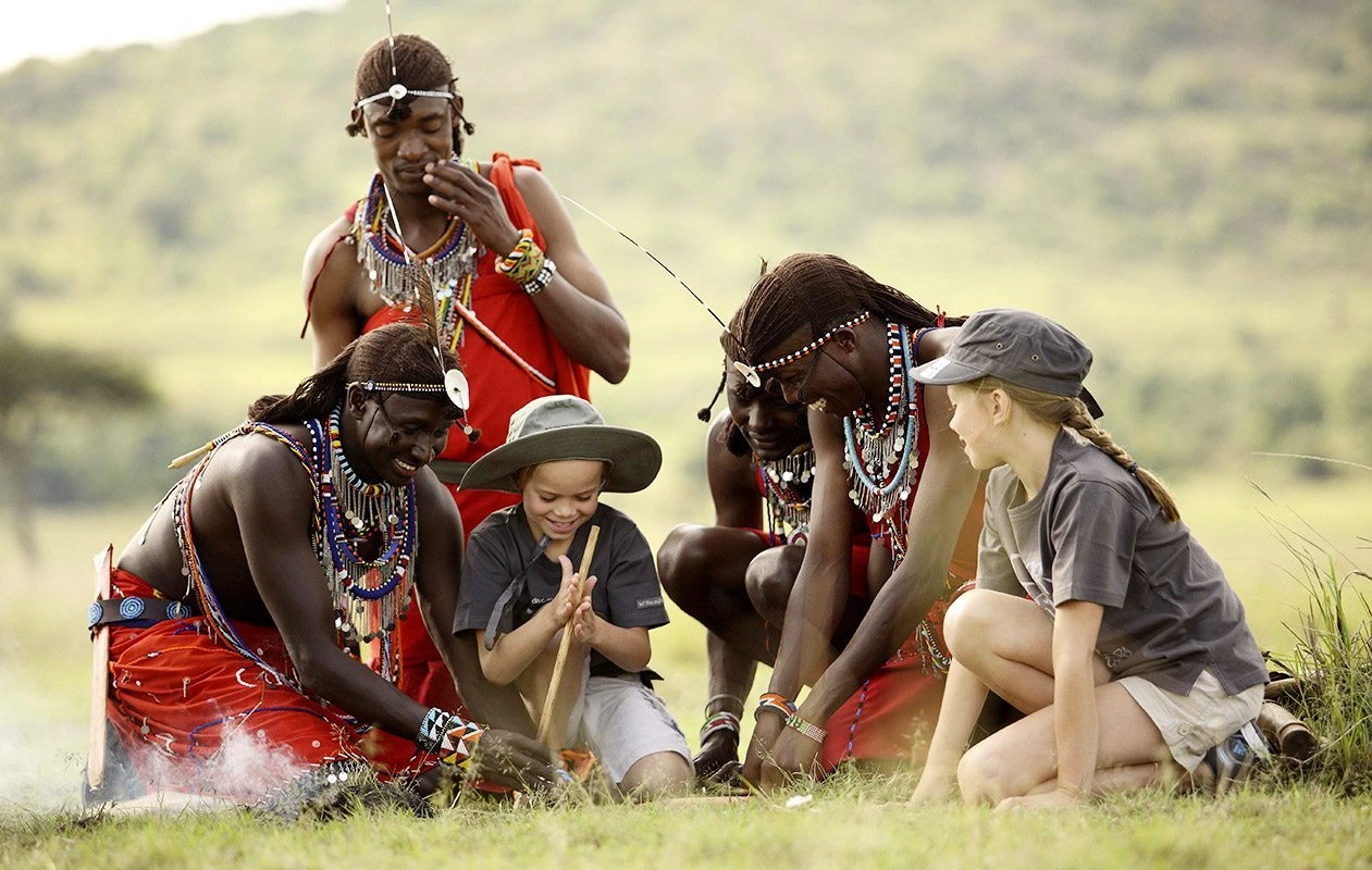 Rise early for an unforgettable hot-air balloon safari, floating above the Serengeti as the sun casts golden hues across the plains. After landing, indulge in a Champagne breakfast in the bush. Spend the afternoon relaxing at the lodge, enjoying its luxurious amenities. As the day ends, hike to the sunset kopje for a yogi-led meditation, taking in panoramic views and the serene beauty of the wilderness at dusk.