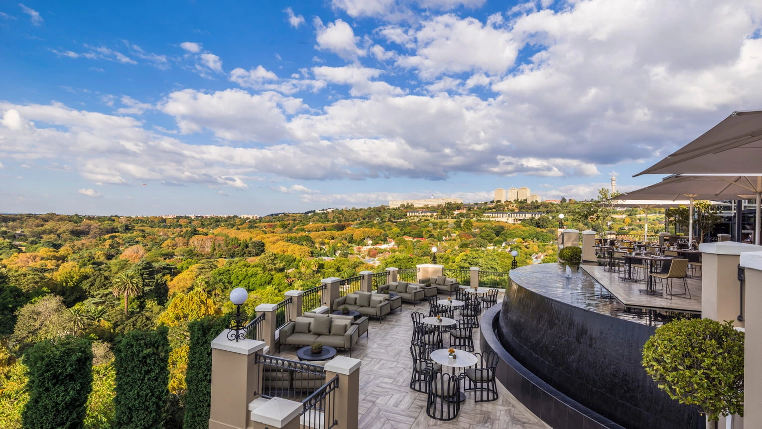Fly into Zambia for a guided visit to the awe-inspiring Victoria Falls, one of the Seven Natural Wonders of the World. Walk along mist-shrouded trails and marvel at the thundering cascade known locally as "the smoke that thunders." This unforgettable experience is a true highlight of the journey. Later, board the Four Seasons jet for a seamless transition to Johannesburg, where your final evening awaits in elegant comfort.