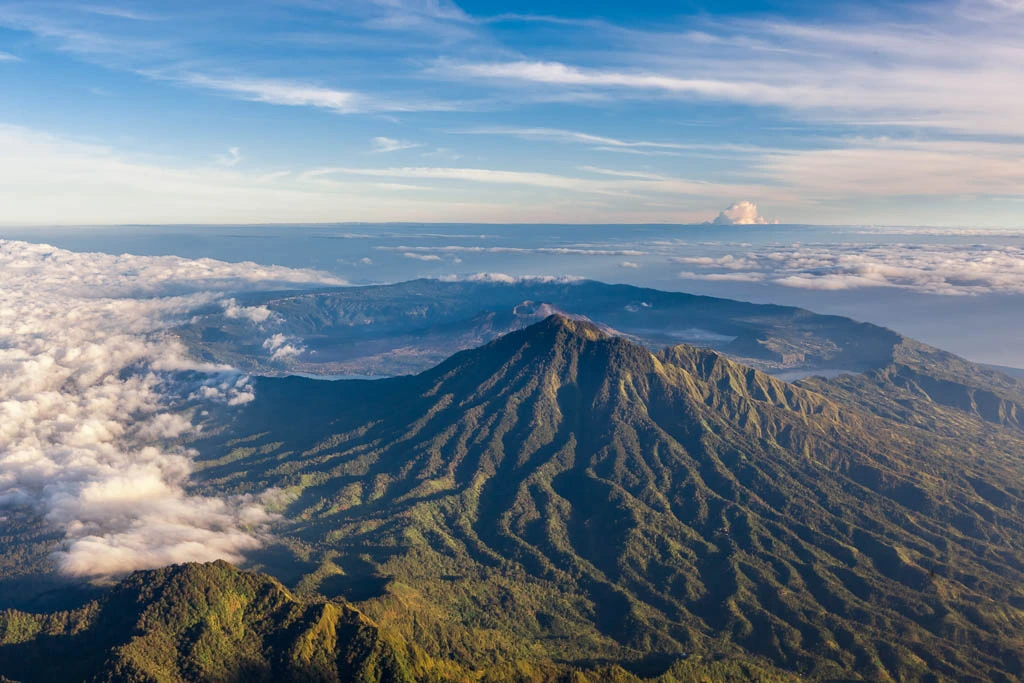 Awaken in Amandari and prepare for a day of discovery in Ubud. Begin with a thrilling 30-minute helicopter ride over Mount Batur and Tegalalang's rice terraces. Enjoy your choice of private guided experiences including sacred temple visits, local art workshops, or a spiritual blessing in Gunung Kawi. Conclude your day with a peaceful dinner, either at Amandari or in town.