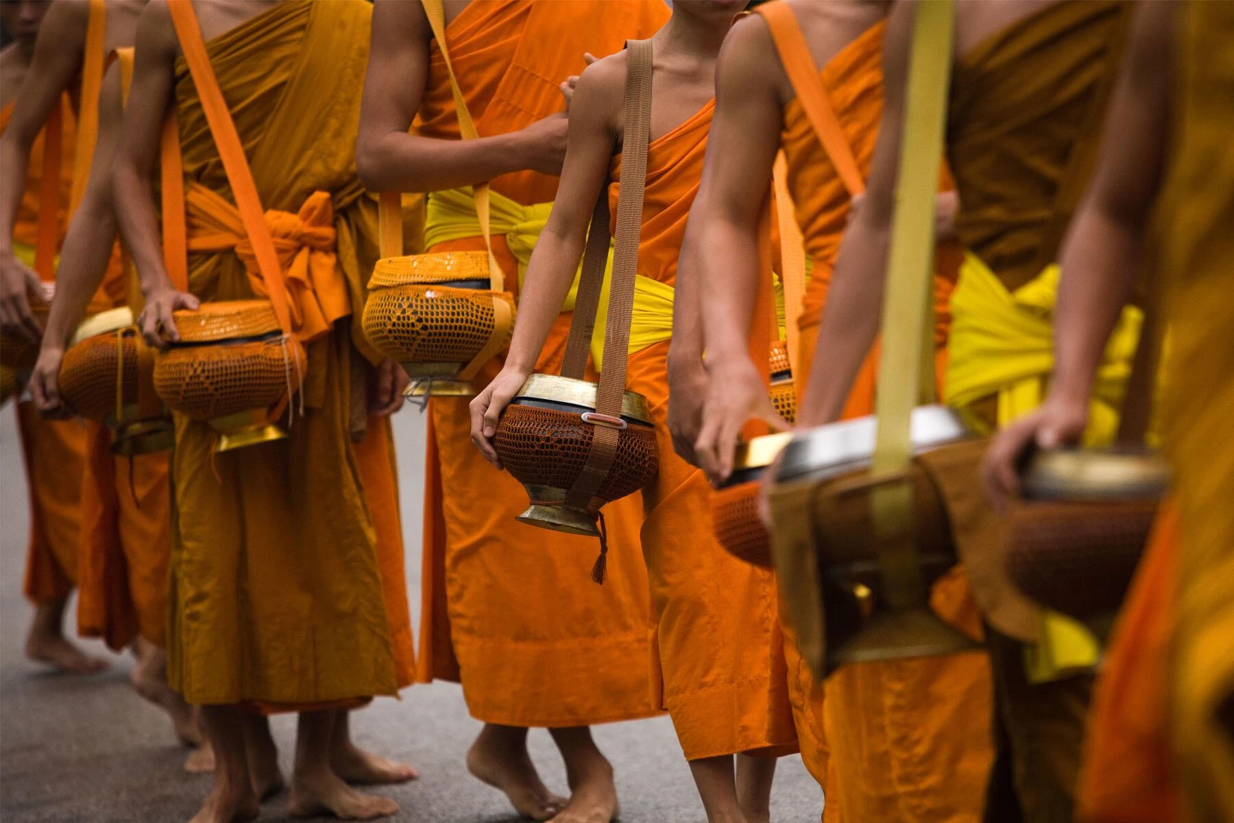 Rise early to take part in the spiritual Tak Bat ceremony, offering alms to saffron-robed monks before exploring a lively local market. After breakfast at Amantaka, enjoy a full day of private guided touring tailored to your interests, with options like a Mekong River cruise to the Pak Ou Caves, village visits, or a swim at Kuang Si Waterfalls. In the evening, participate in a moving Baci blessing ceremony and festive dinner by the pool.