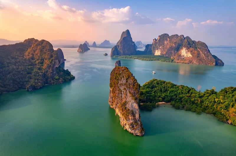 Fly from Siem Reap to Phuket by private jet and arrive at the tranquil Amanpuri resort. Enjoy the afternoon at leisure�relax on the beach, try complimentary water sports, or book a soothing treatment at Aman Spa. Optionally, embark on a private helicopter flight for breathtaking views over Phang Nga Bay. In the evening, dine at one of Amanpuri�s restaurants or explore local fine dining options at your own pace.