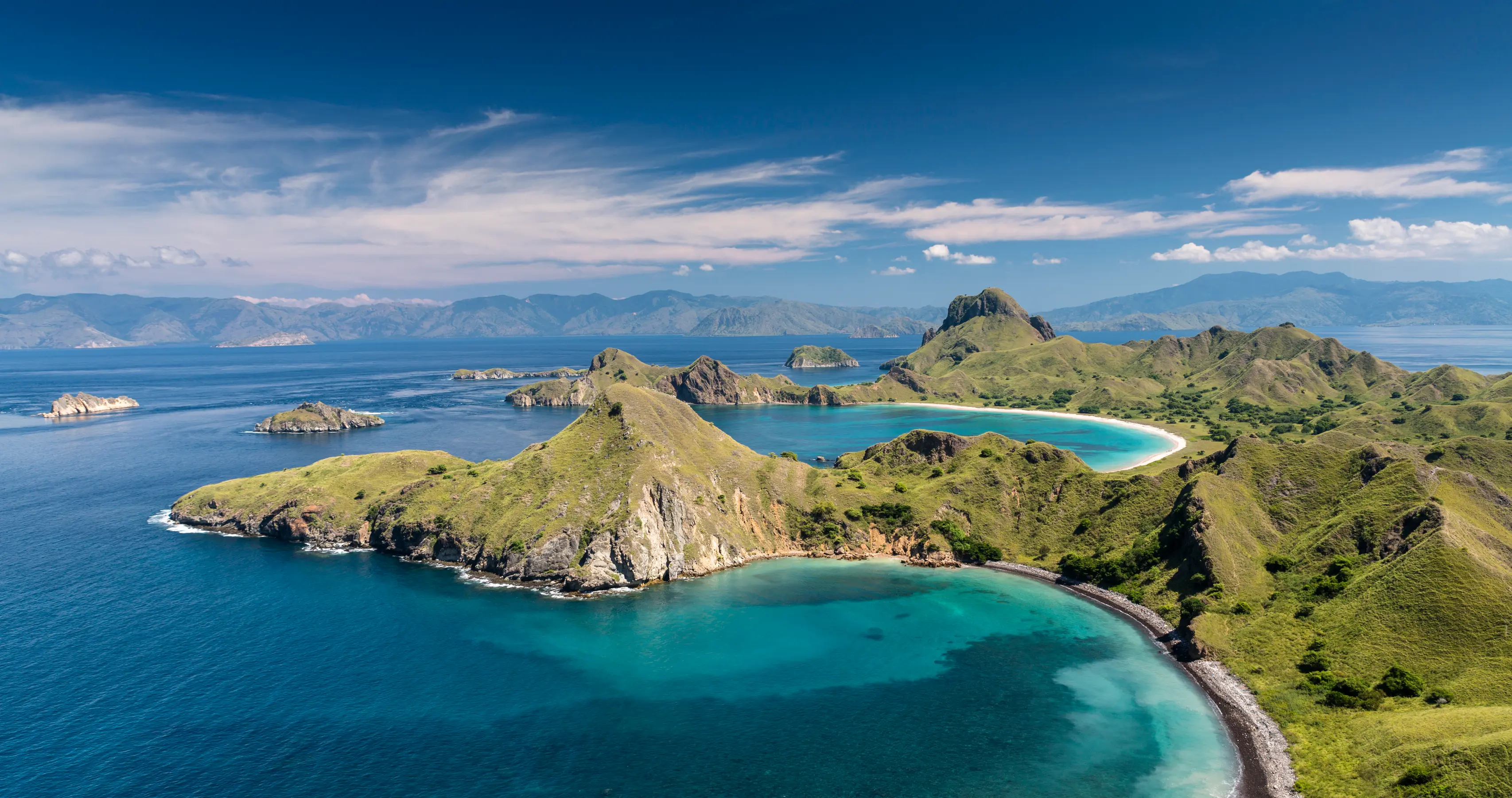 Cruise through a scenic sea passage to Rinca Island. Visit Horseshoe Bay and explore its volcanic landscape. Spot Komodo dragons and sea eagles aboard tenders, or enjoy a swim. In the late afternoon, unwind on the iconic Pink Beach.