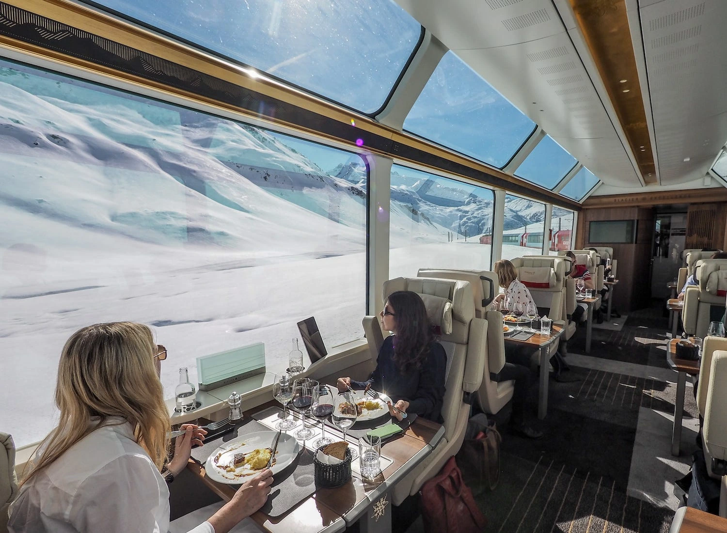 Embark on the Glacier Express in Excellence Class, a journey through the heart of the Swiss Alps. Arrive in Andermatt and check into The Chedi Andermatt for a luxurious overnight stay. Spend the afternoon exploring the hotel`s award-winning spa, relaxing by the fireplace lounge, or savoring its Michelin-starred Japanese cuisine. Take time to wander the alpine village before returning for evening cocktails.