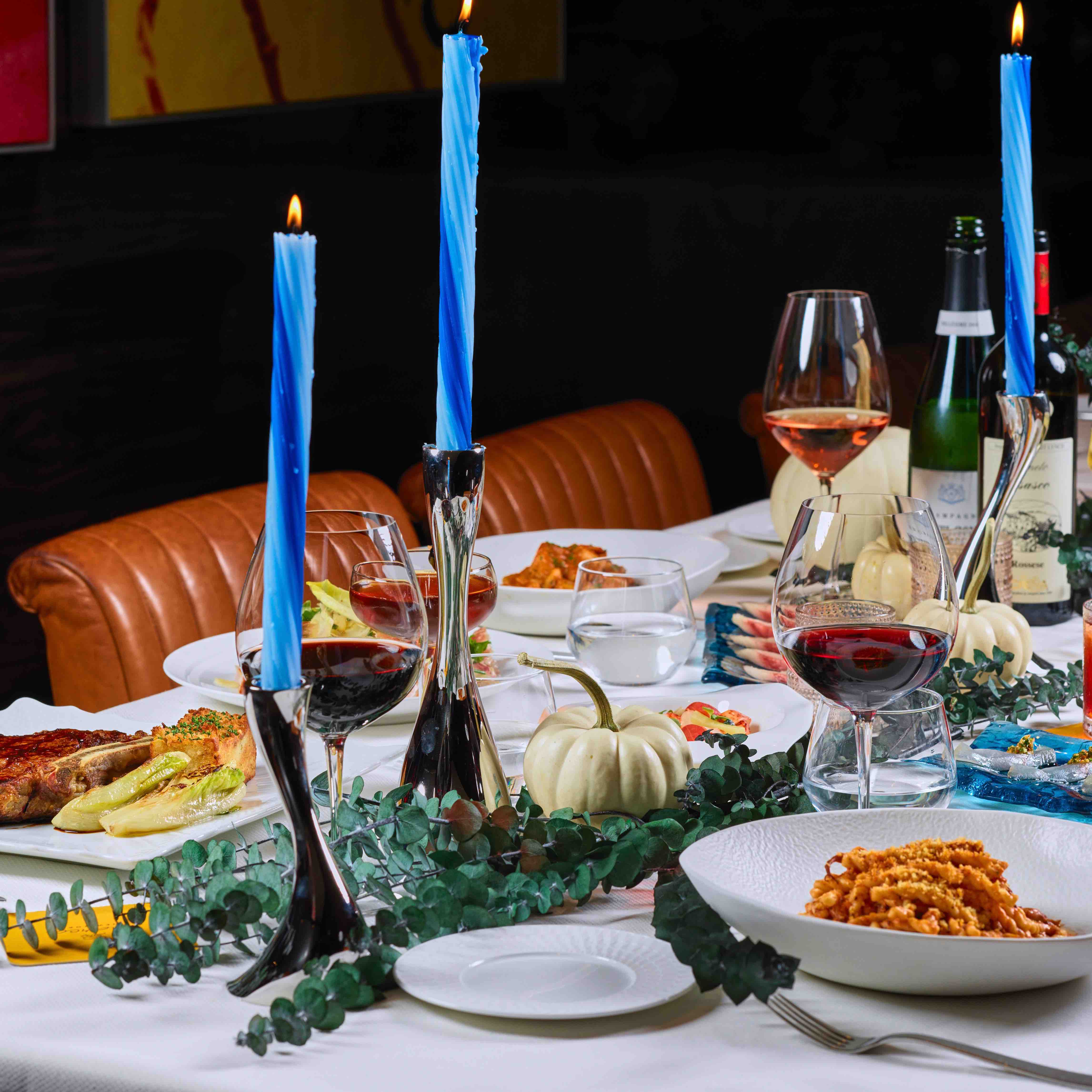 a full table, decorated for thanksgiving