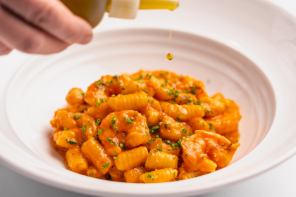 olive oil dropped on close up of bowl of gnocchetti pasta at marea
