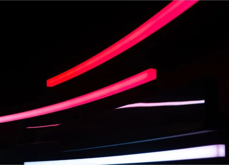 a blurry photo of neon lights in the dark