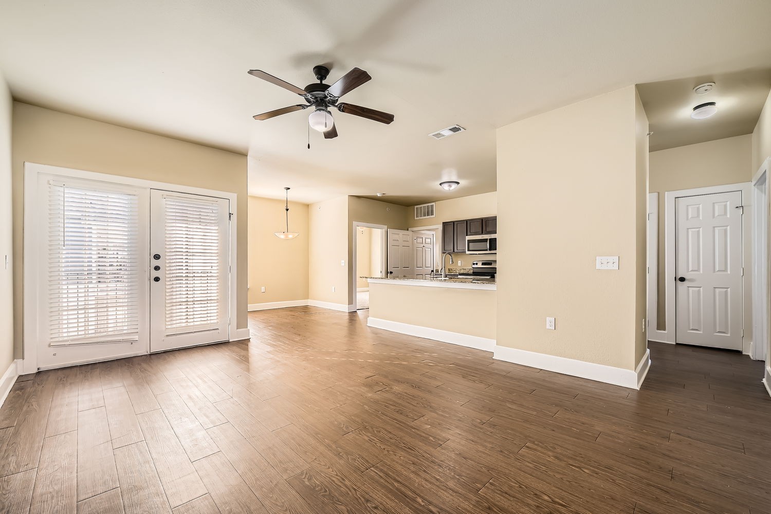 Empty Living Room with brown cabinets