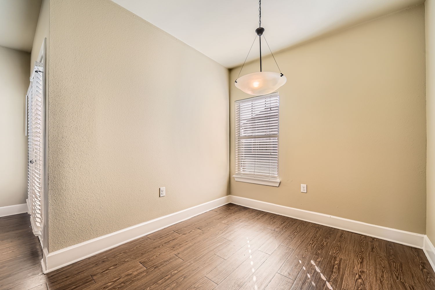 Empty dining room with wood flooring