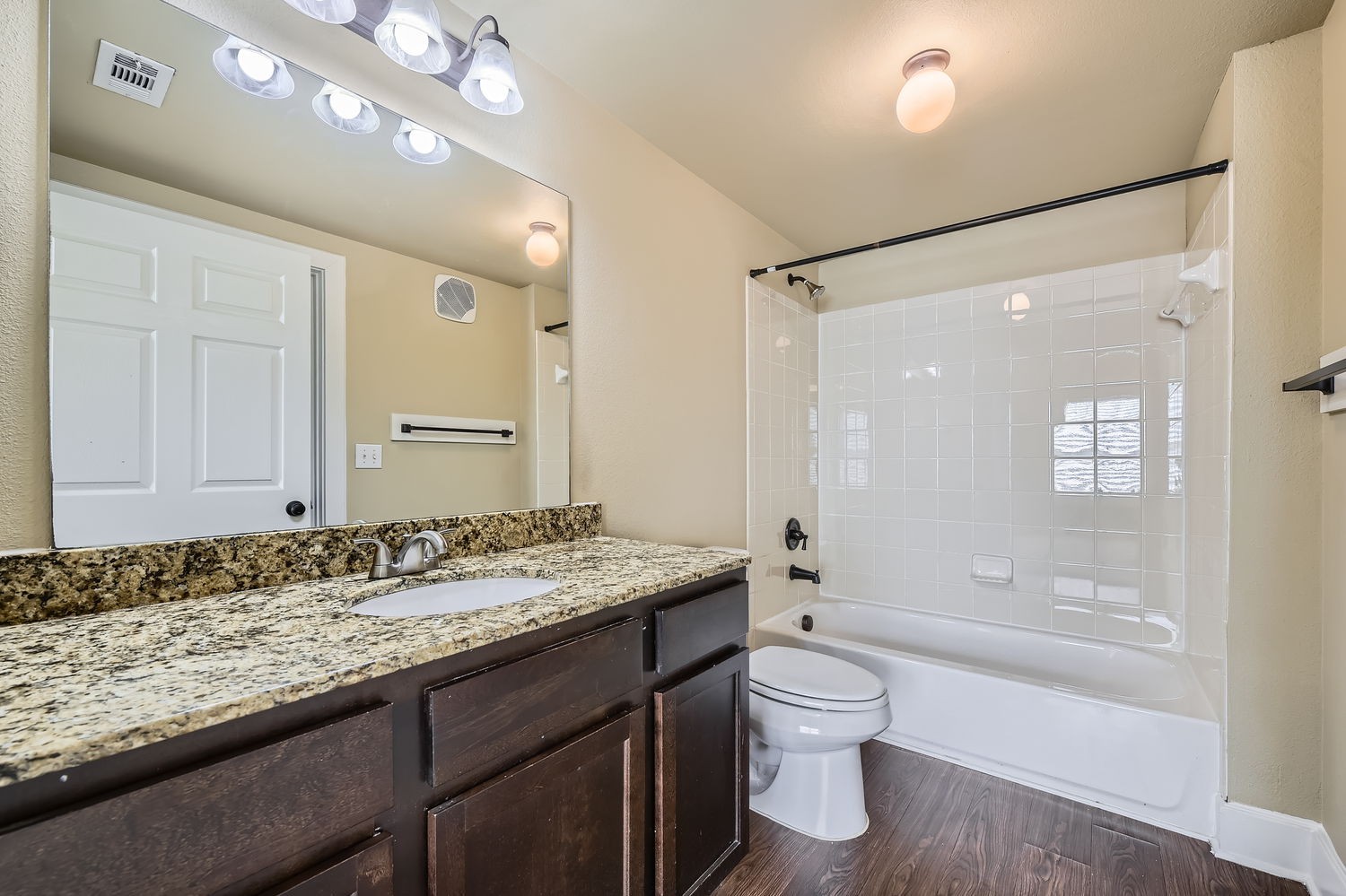 Bathroom with brown cabinets