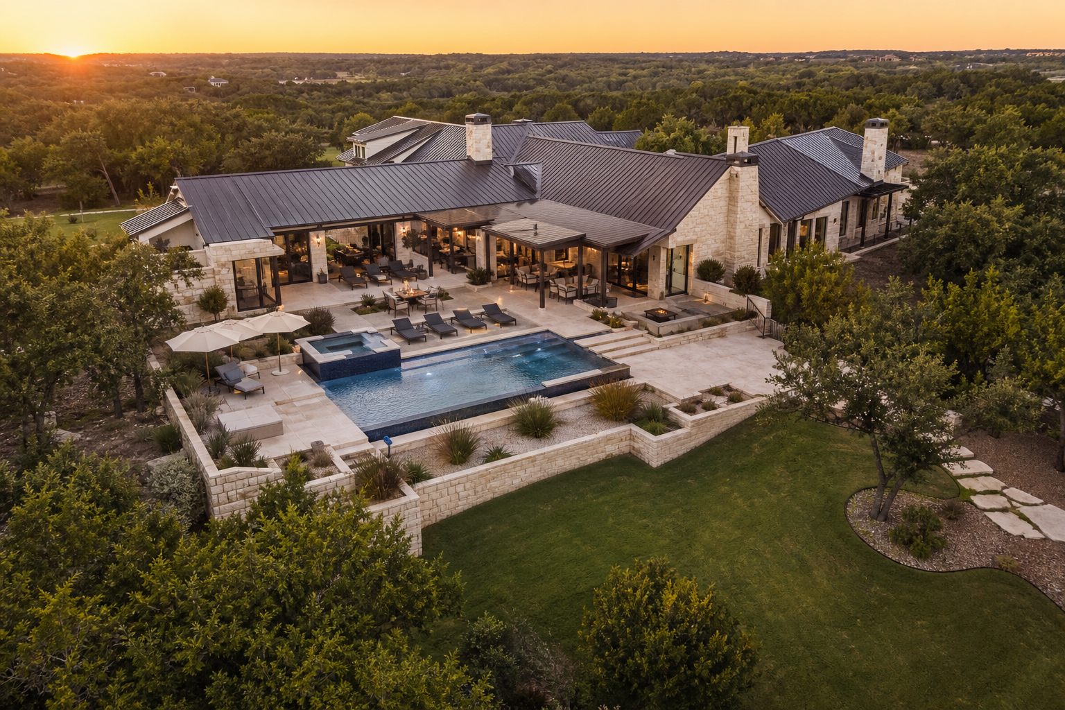 Aerial view of luxury vacation rental estate with pool and Texas Hill Country landscape