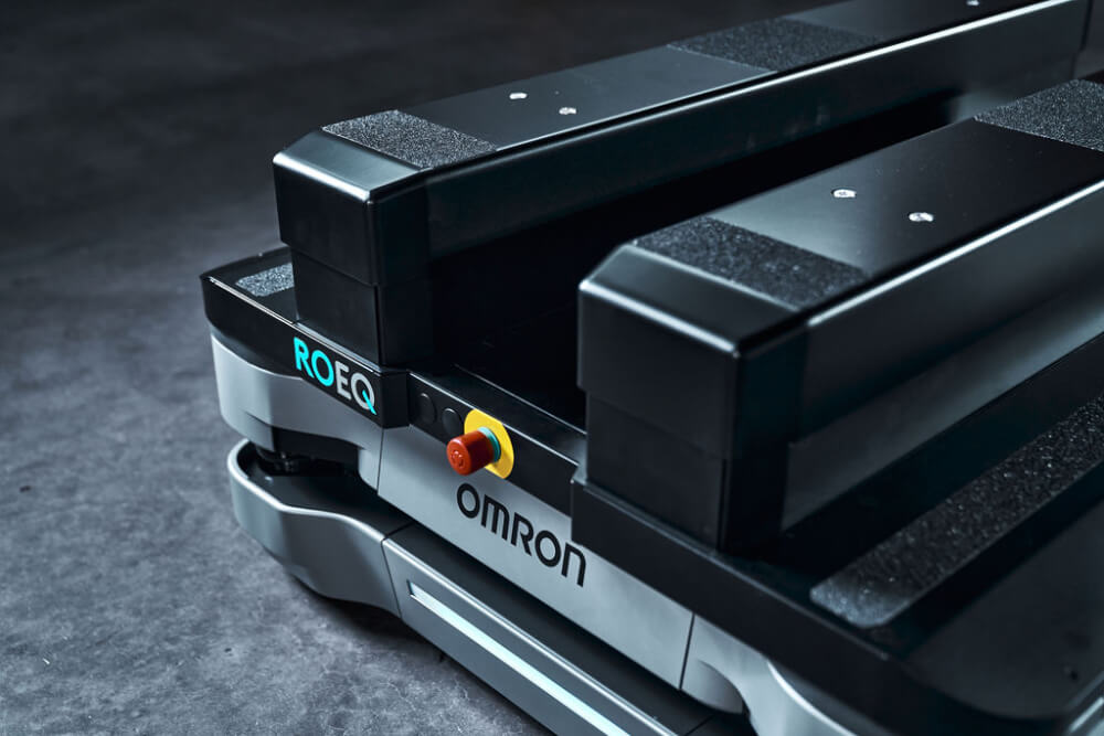 Close-up of ROEQ TML500 lifter on autonomous mobile robot for warehouse pallet transport