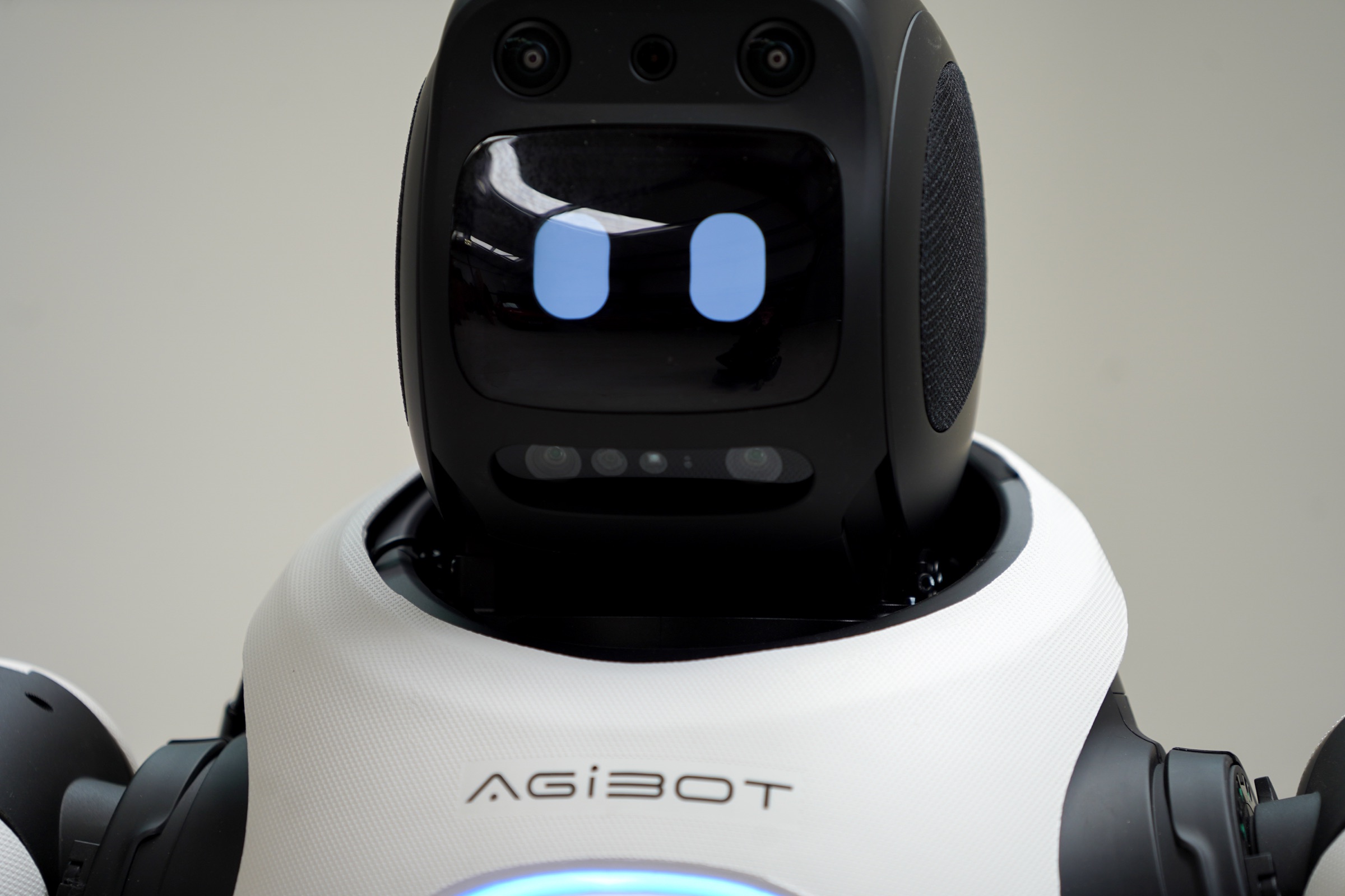 Close-up of AGIBOT X2 expressive display face and camera array