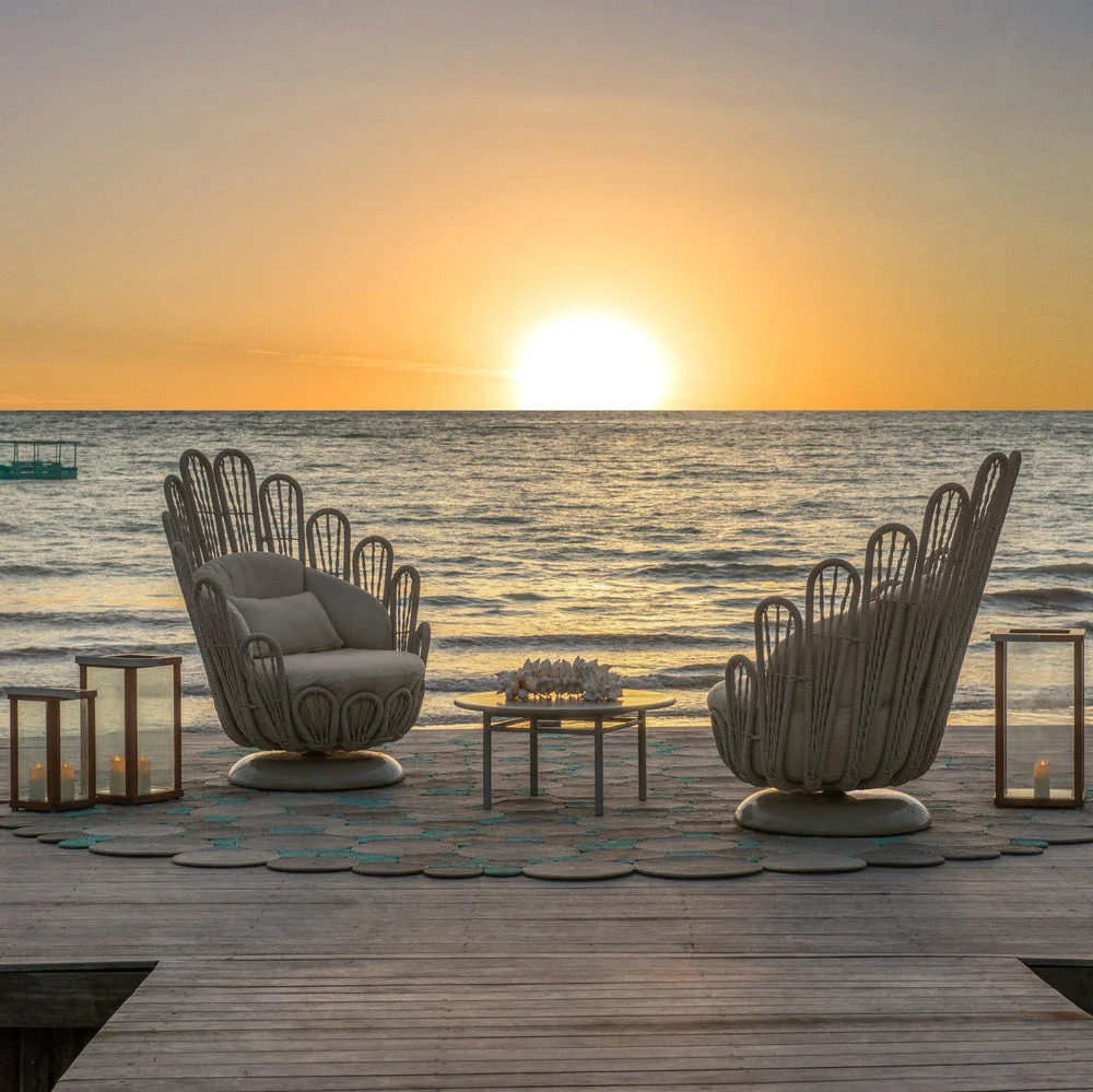 Sculptural Tidelli Milagres chairs overlooking the ocean at sunset
