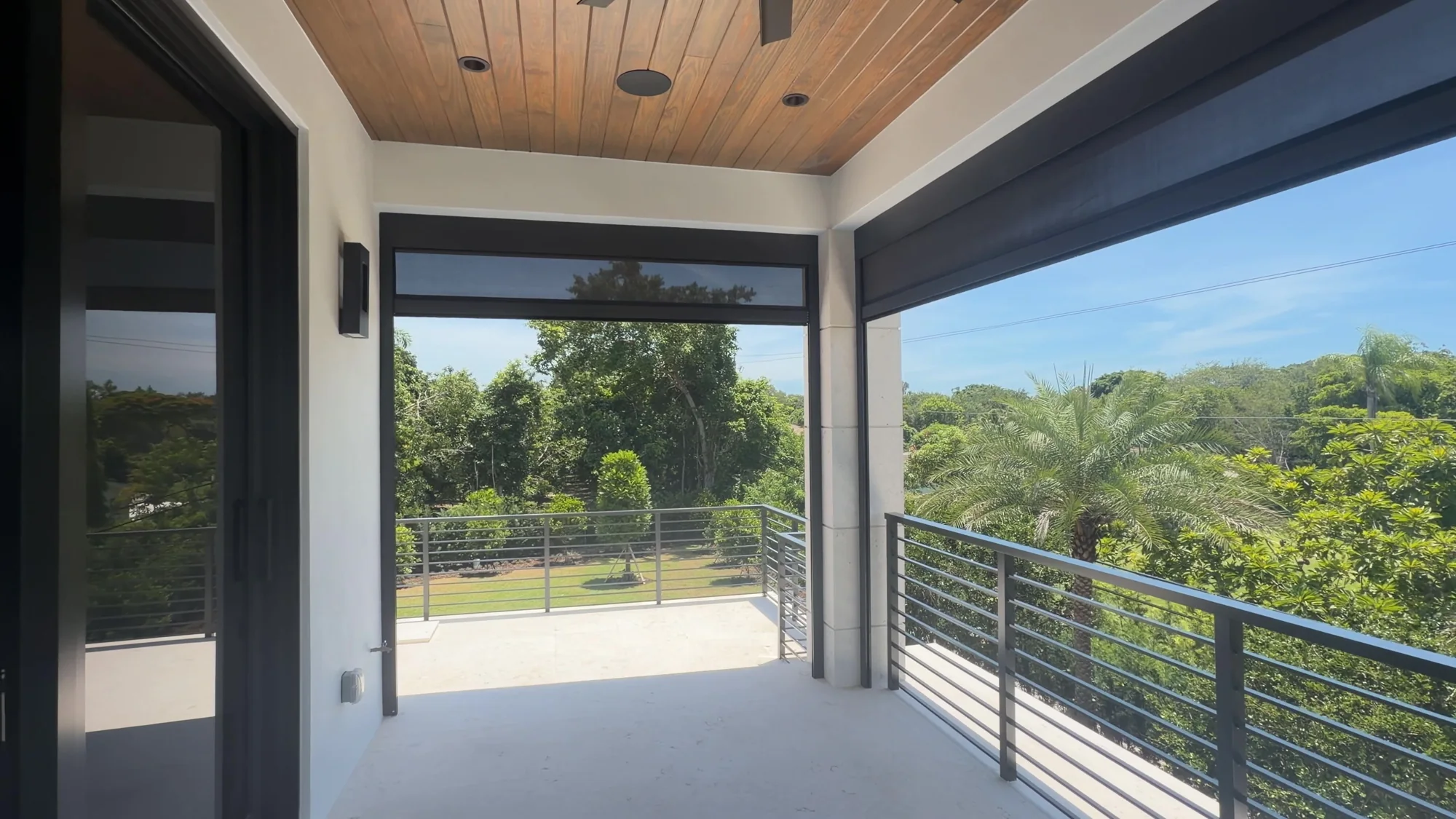 Balcony openings with the exterior screens raised.