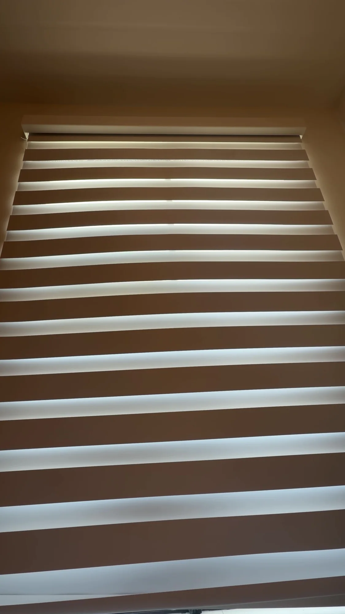 Close view of the alternating opaque and sheer fabric bands.