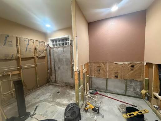 Bathroom preparation or shower remodel in progress with clean demolition, waterproofing, or plumbing work.