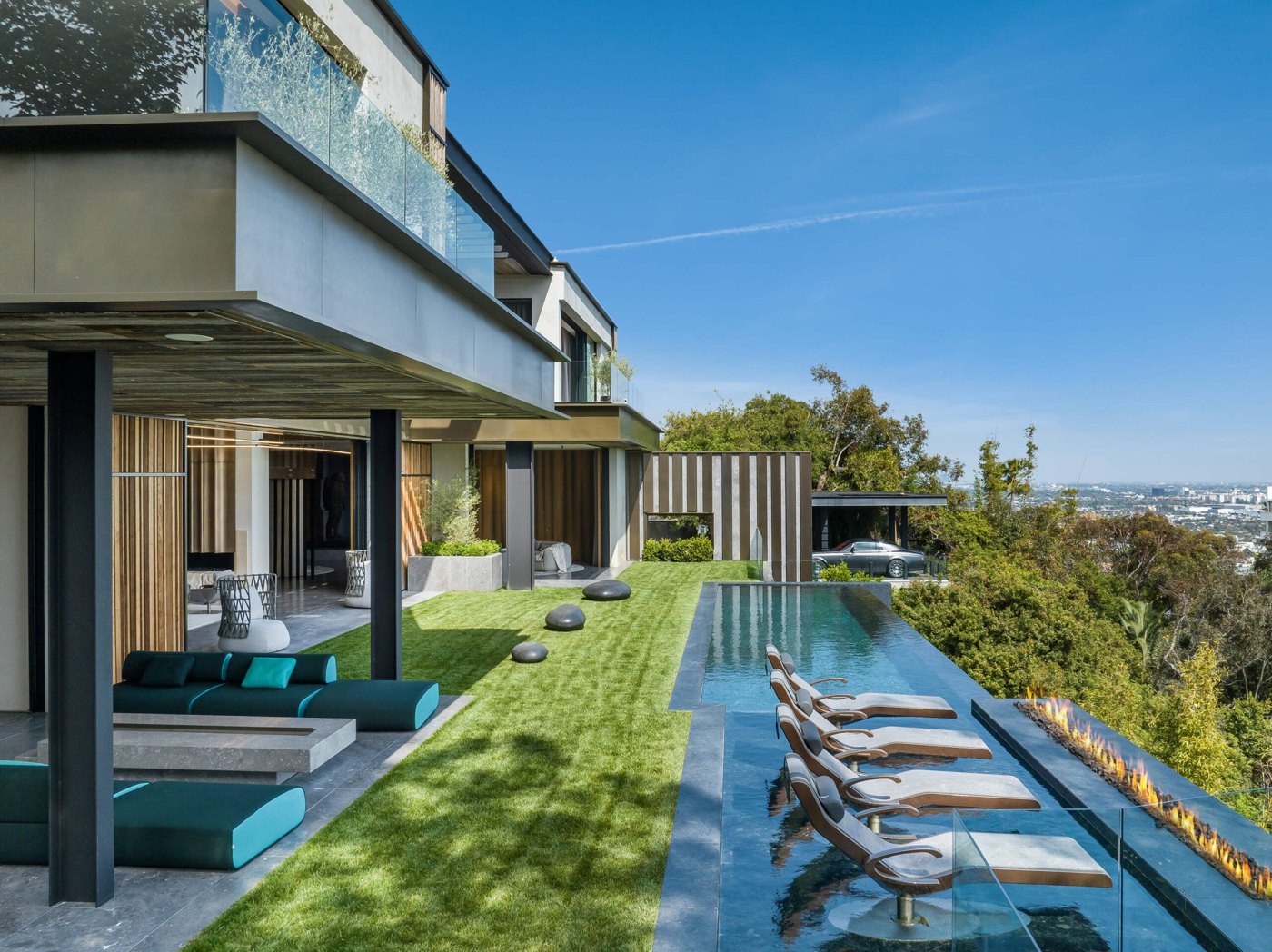 Hollywood Hills home with an infinity pool on the hillside terrace, the city spread out below