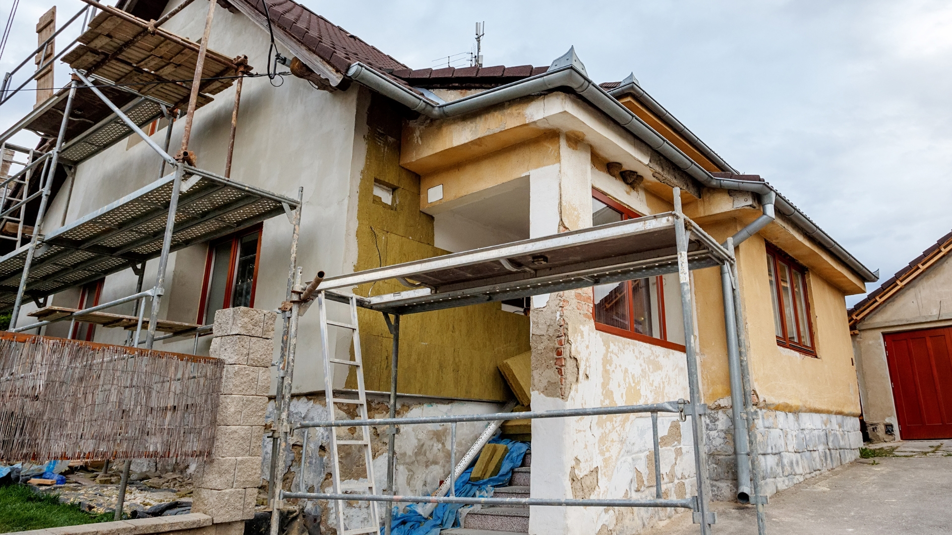 A home with scaffolding during a home remodel project