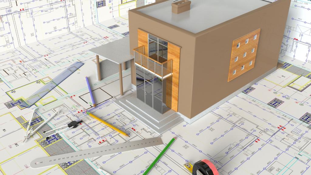 Architectural model and blueprints illustrating the planning phase of a commercial remodeling project in Los Angeles