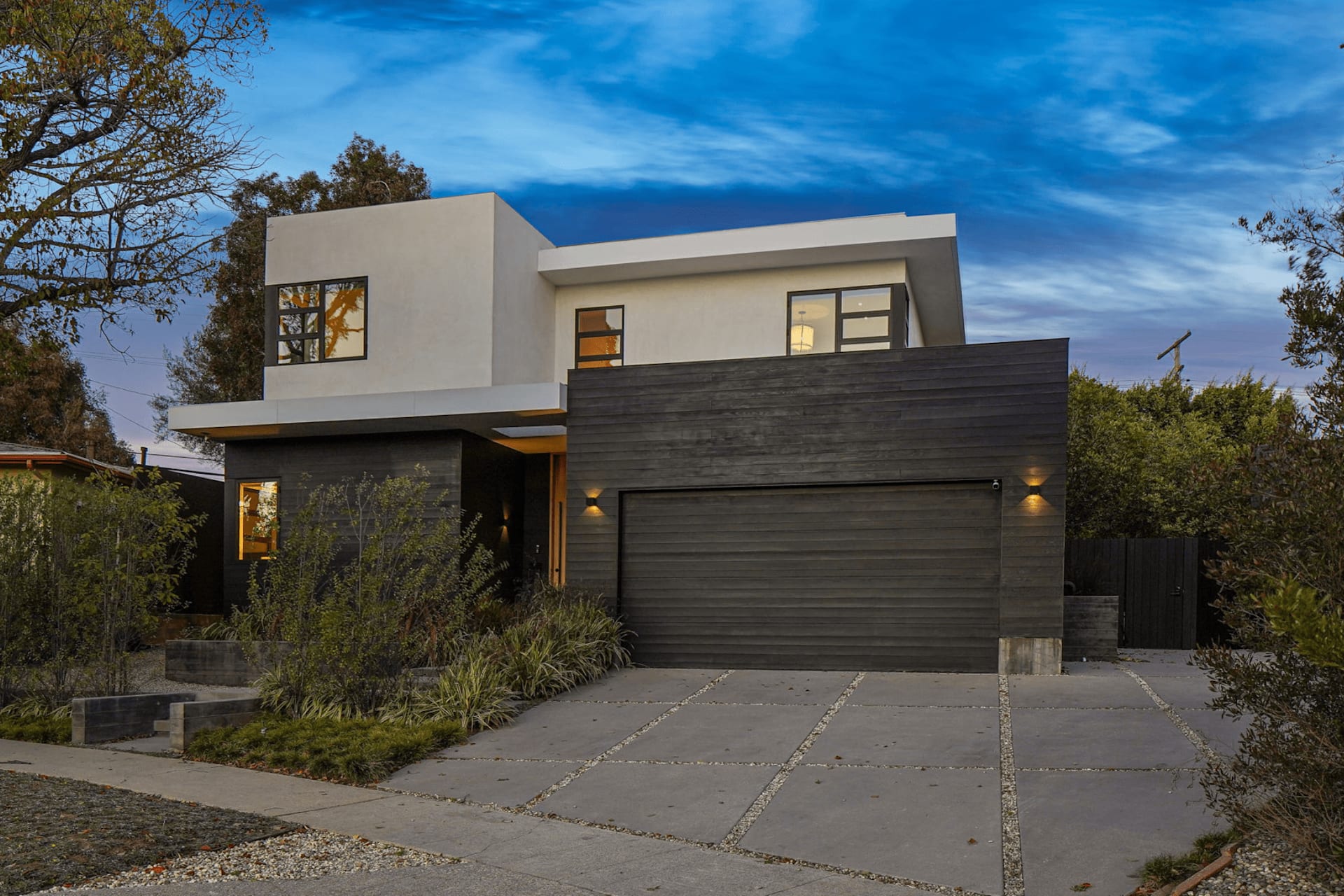Modern two-story home exterior after general remodeling on Halderman Street in Los Angeles with new driveway and garage.