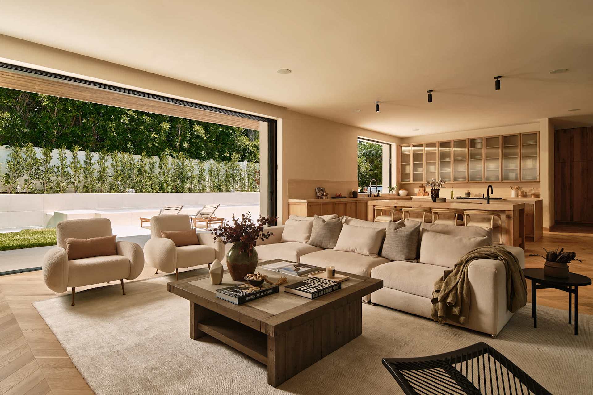 Open concept living room and kitchen with a large sliding glass wall