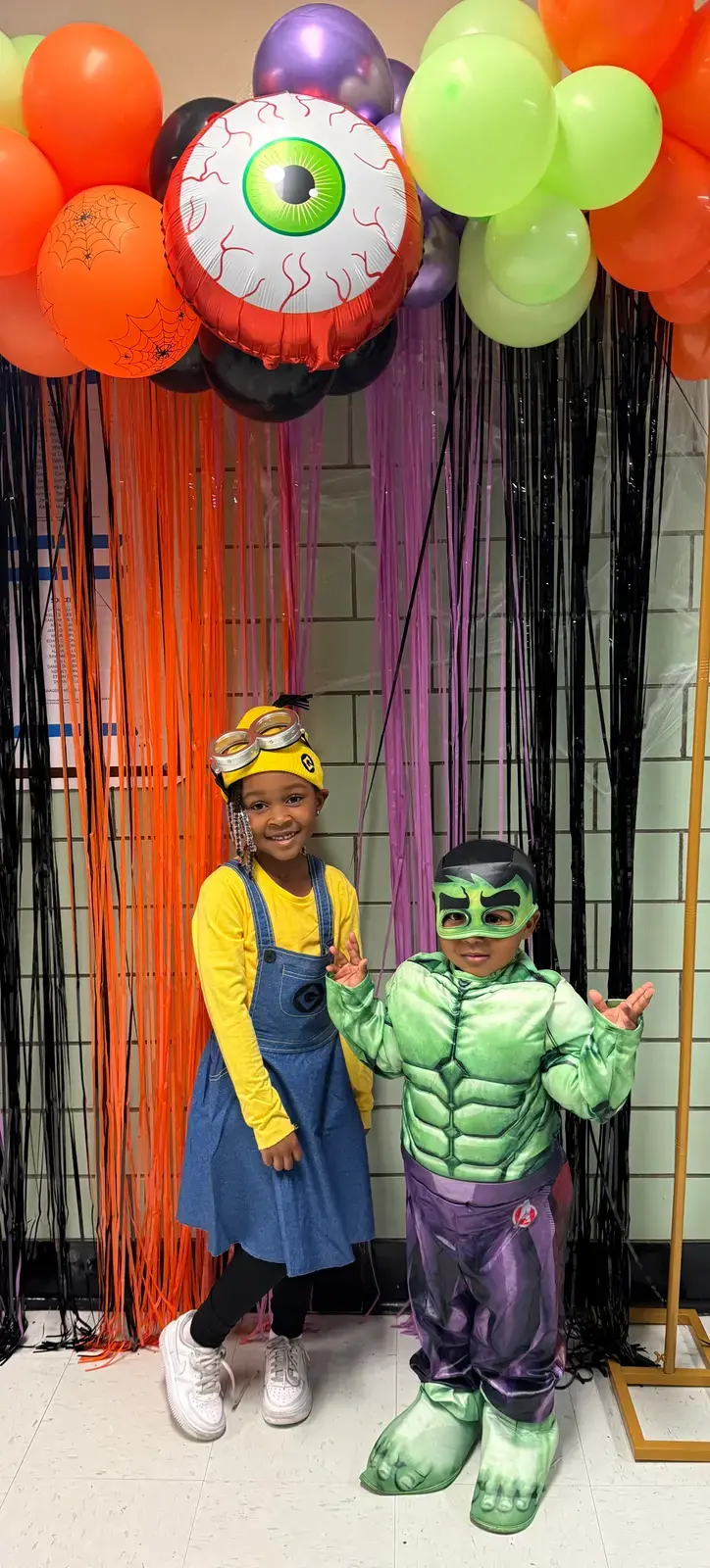 Students in Halloween costumes at school celebration