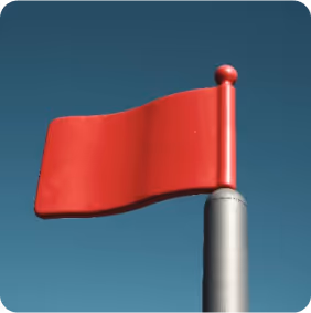 Red flag waving on a silver pole against a clear blue sky.