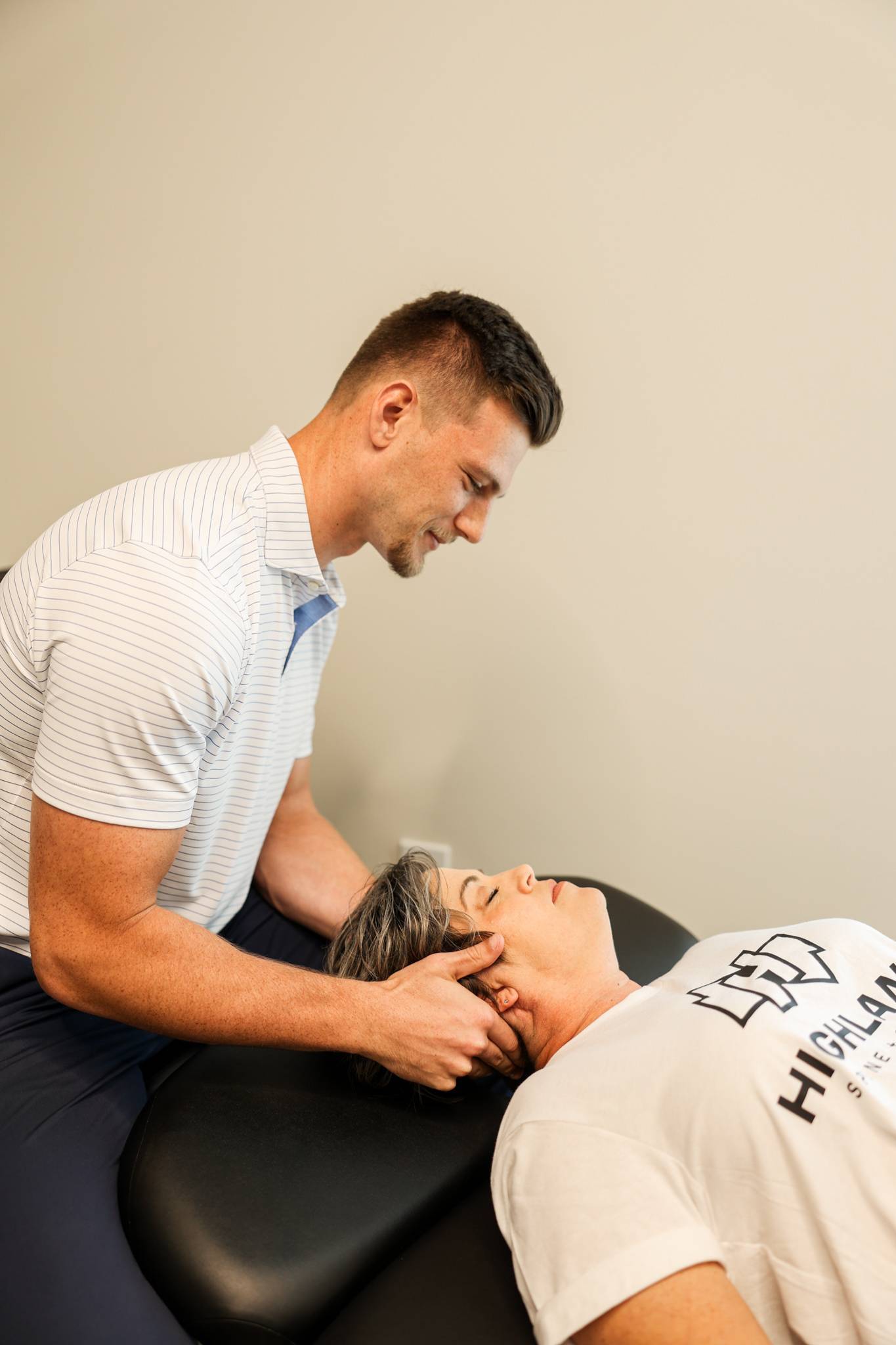 Chiropractor doing an adjustment on a patient's ankle