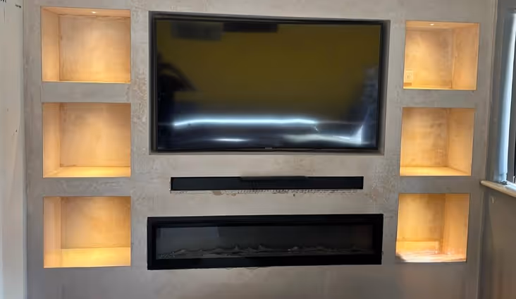 Media wall with shelf lighting