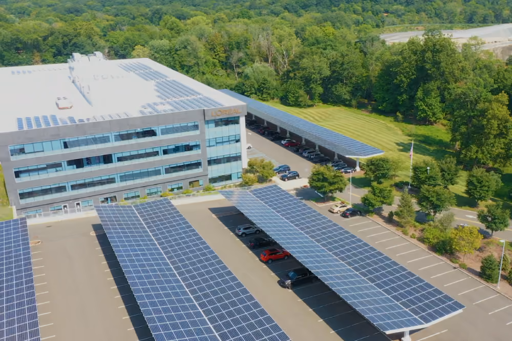 Solar panel roofing above cars in the parking lot