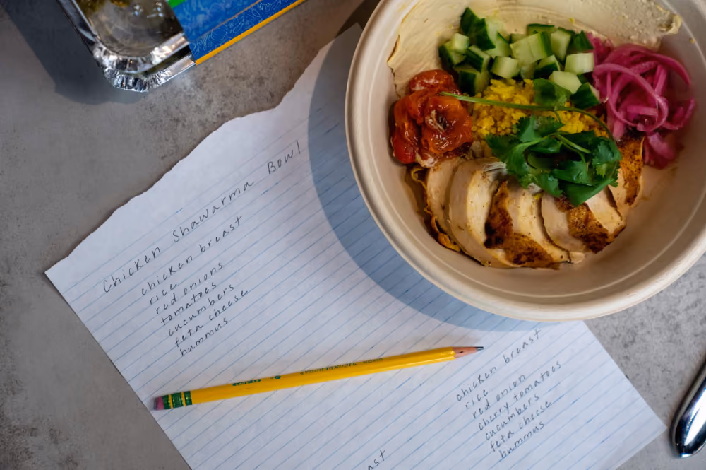Chicken shawarma bowl next to its recipe