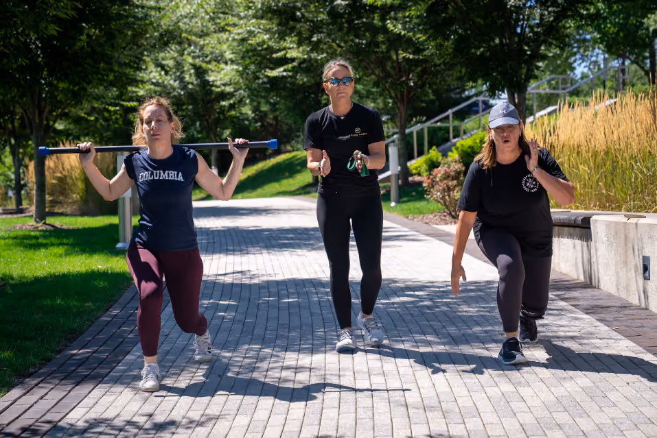 Three people doing workouts on The Trail