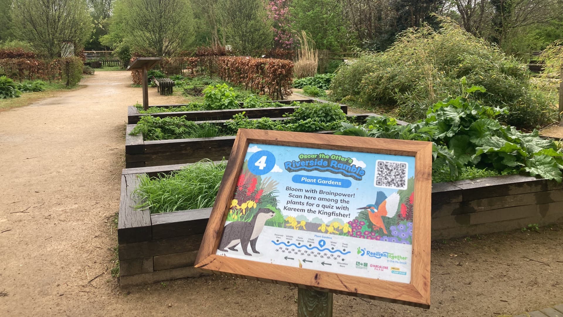 Riverside Ramble interactive signage at Standalone Farm, in partnership with Central Bedfordshire Council, in a garden