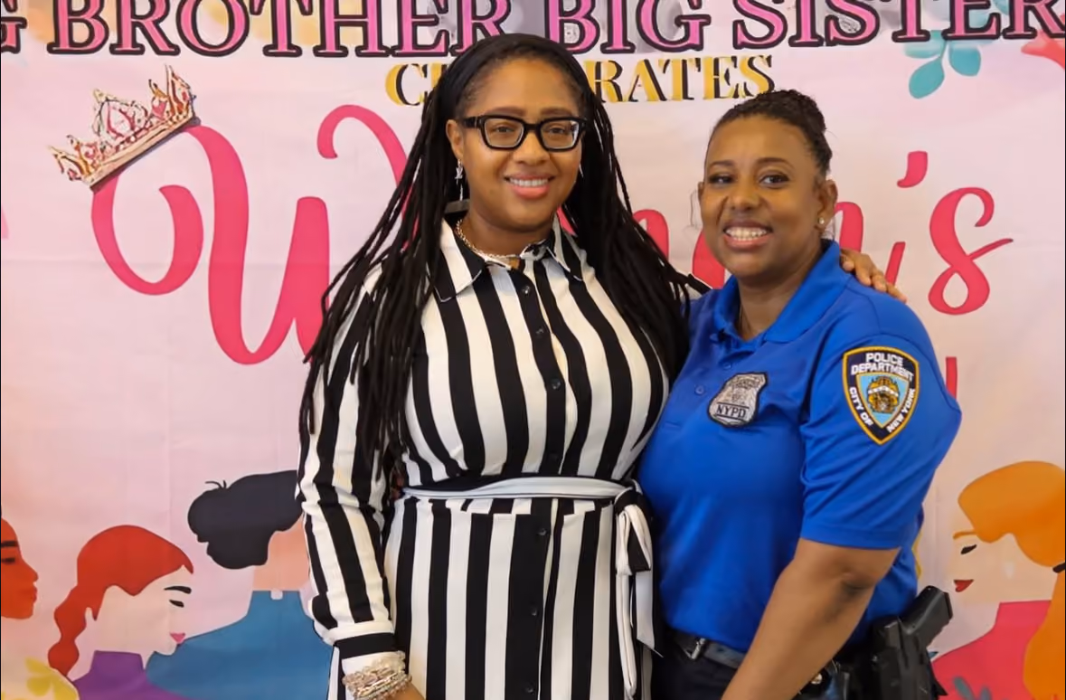 Two women posing at Big Brother Big Sister Women's celebration event