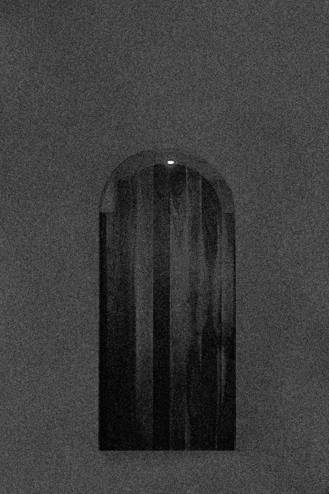 a grainy door floating in the middle of nowhere