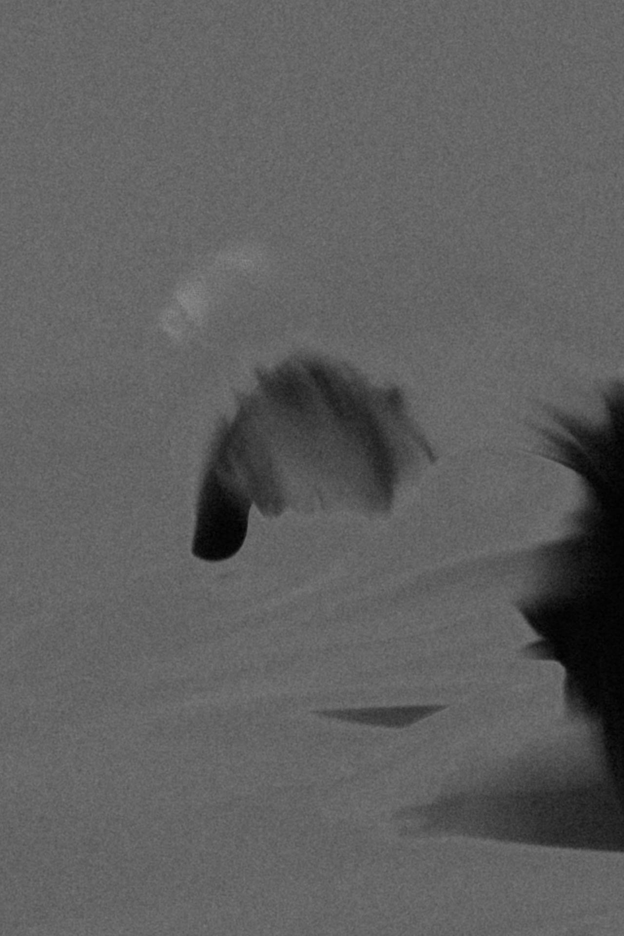 faceless man looking down
