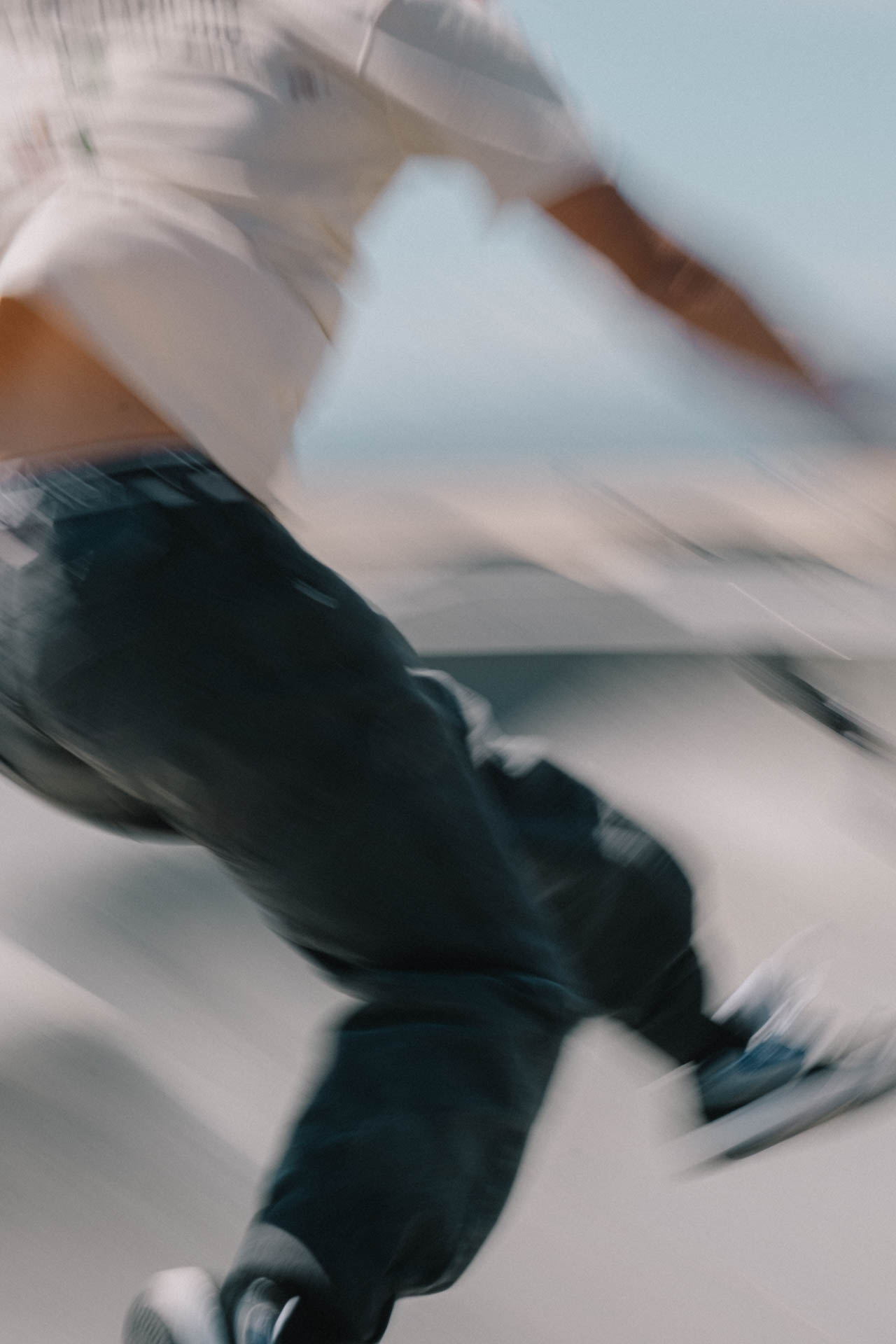 Venice Beach skateboarder in motion falling in the pool