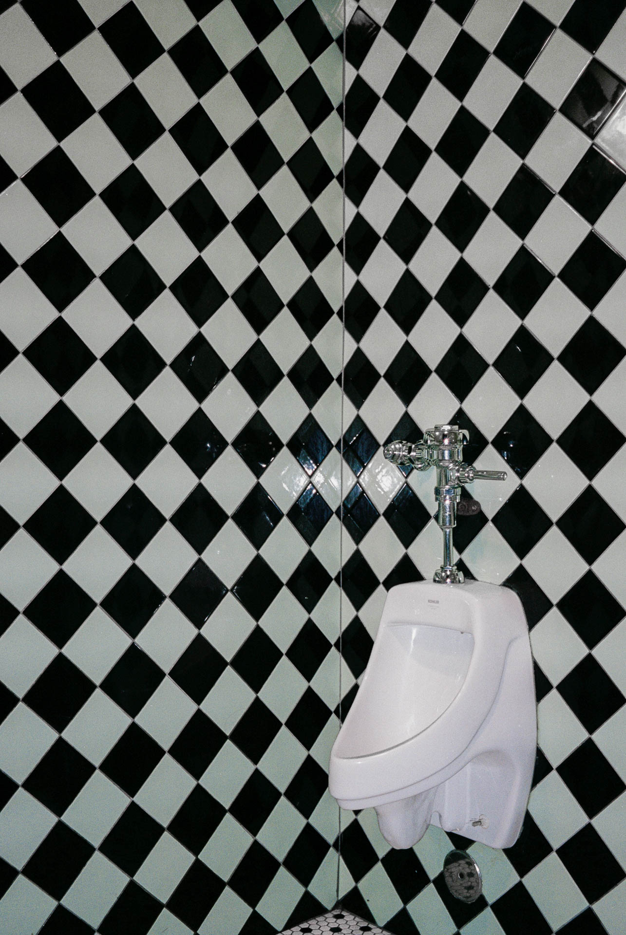 bathroom with black and white checkered tile