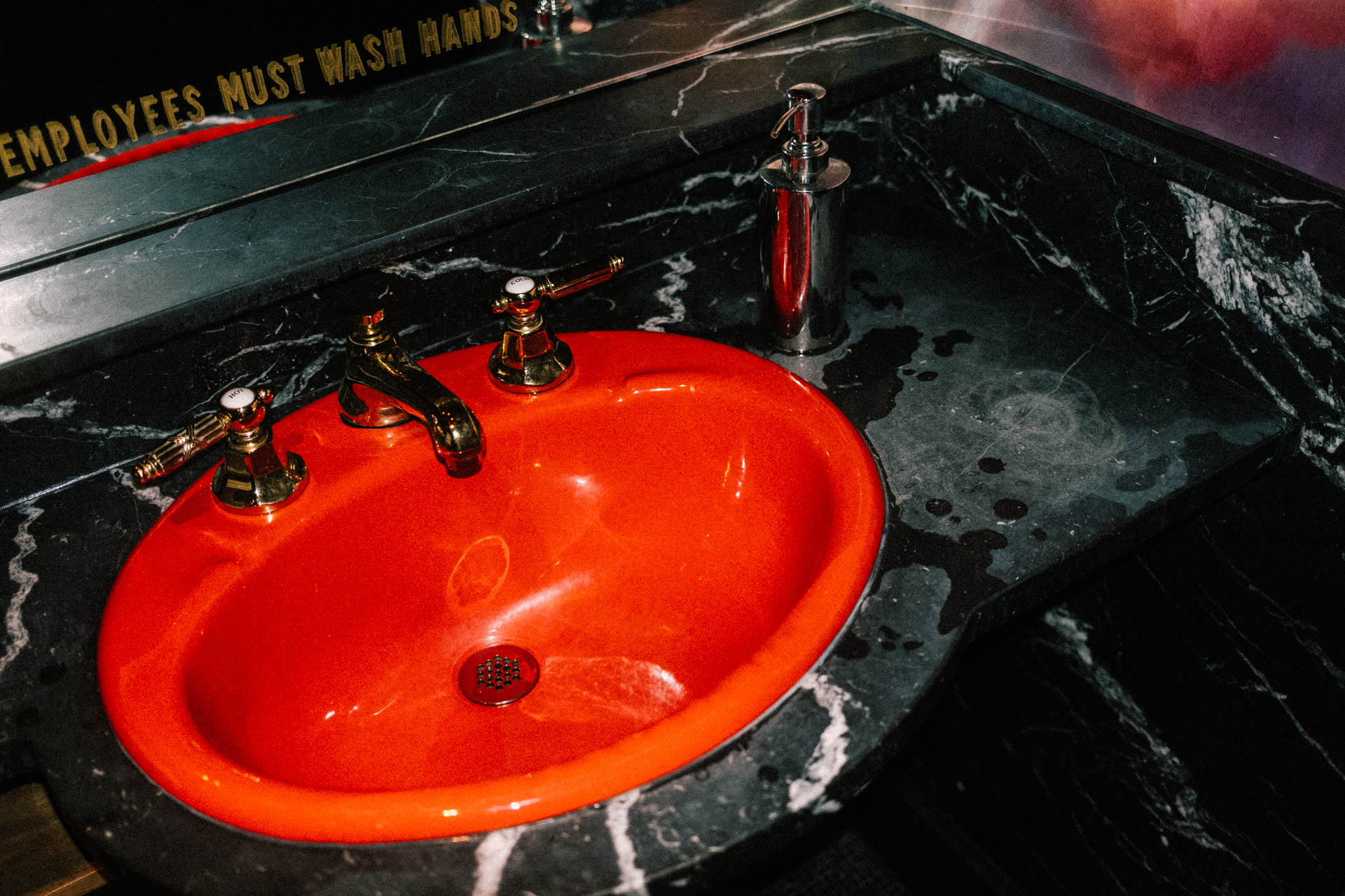 bright red sink in a bathroom