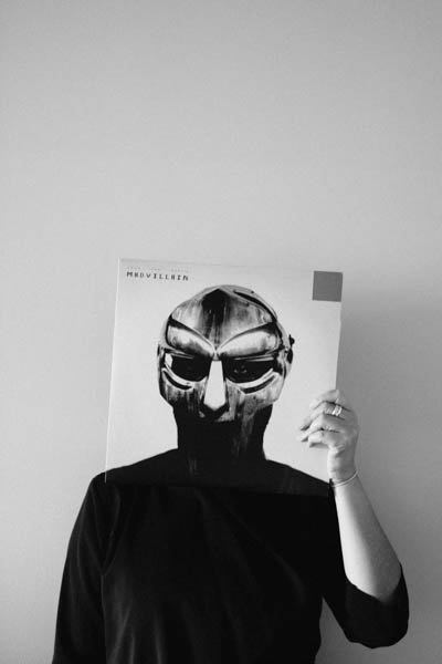 woman holding vinyl over face thumbnail