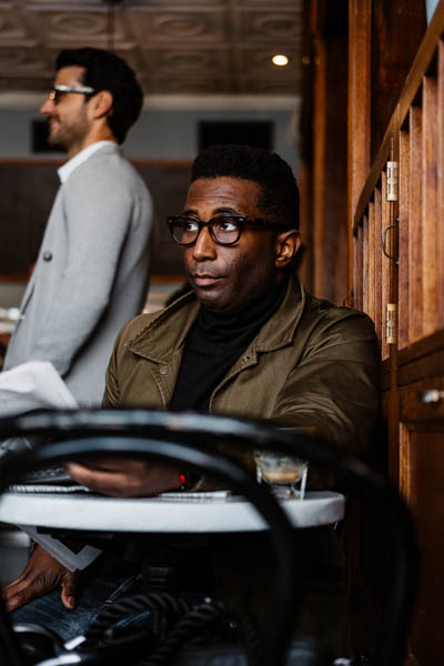 man looking out coffee shop thumbnail