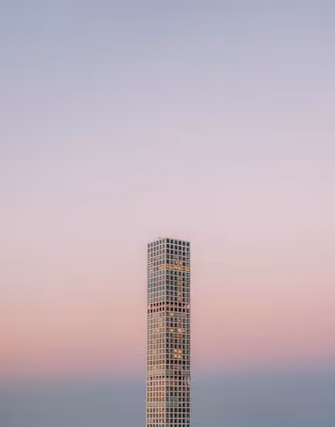 432 Park Ave skyscraper building with sunset behind it in New York City