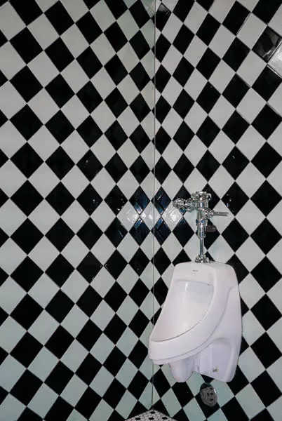 bathroom with black and white checkered tile